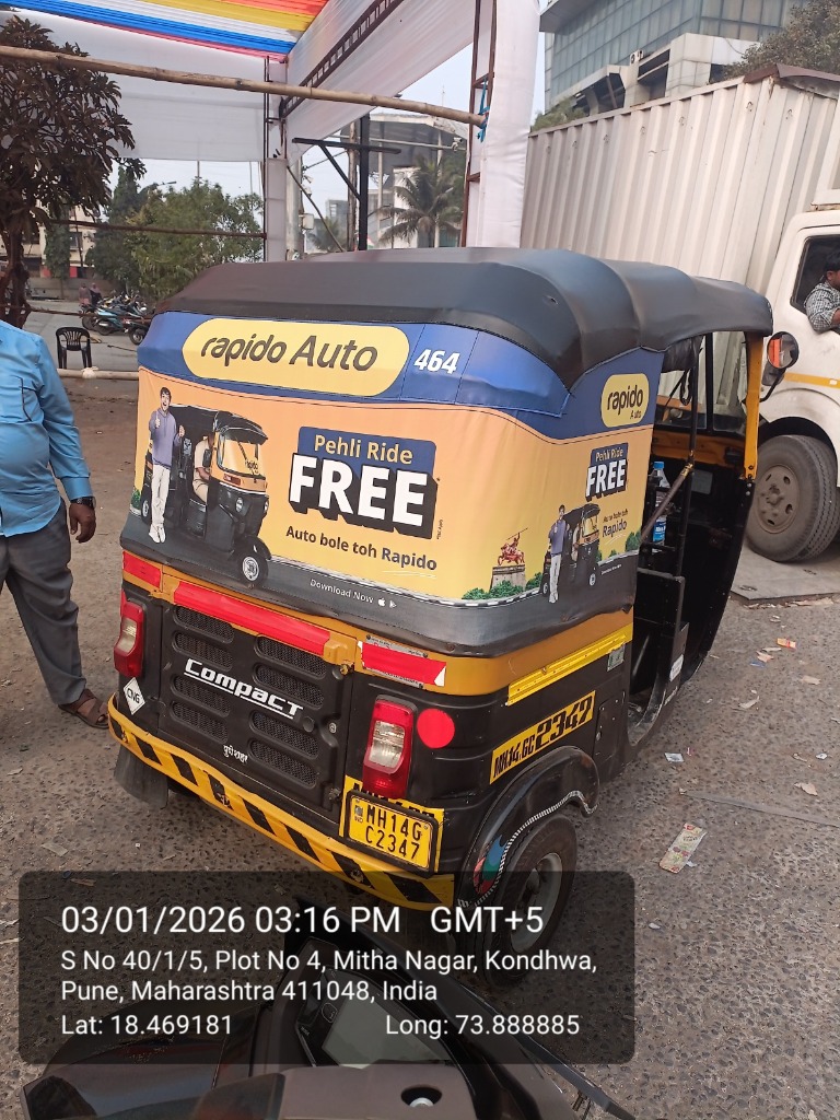 Rapido Auto Rickshaw Hood Branding three-quarter profile showing side flap and hood wrap
