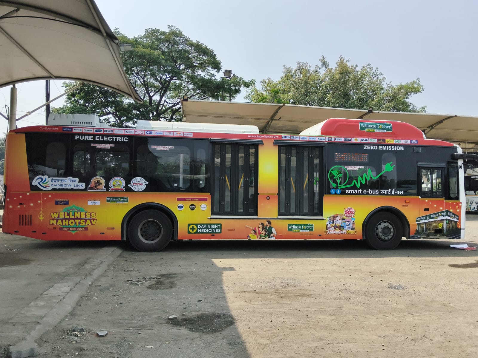 Wellness Forever Pune Bus Branding full side profile